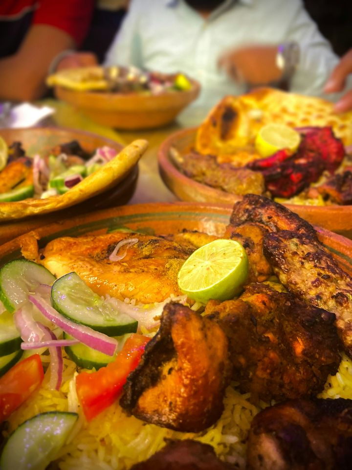 A family meal spread with rice and chicken