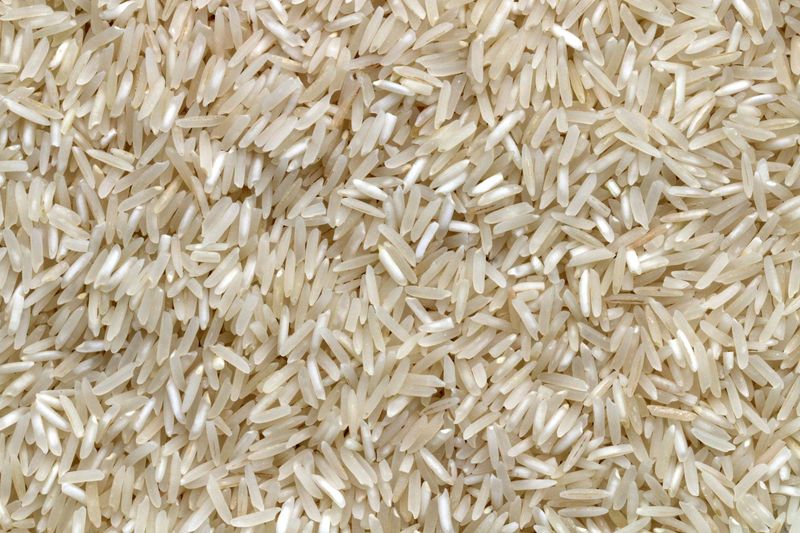 Raw long-grain white rice, close up